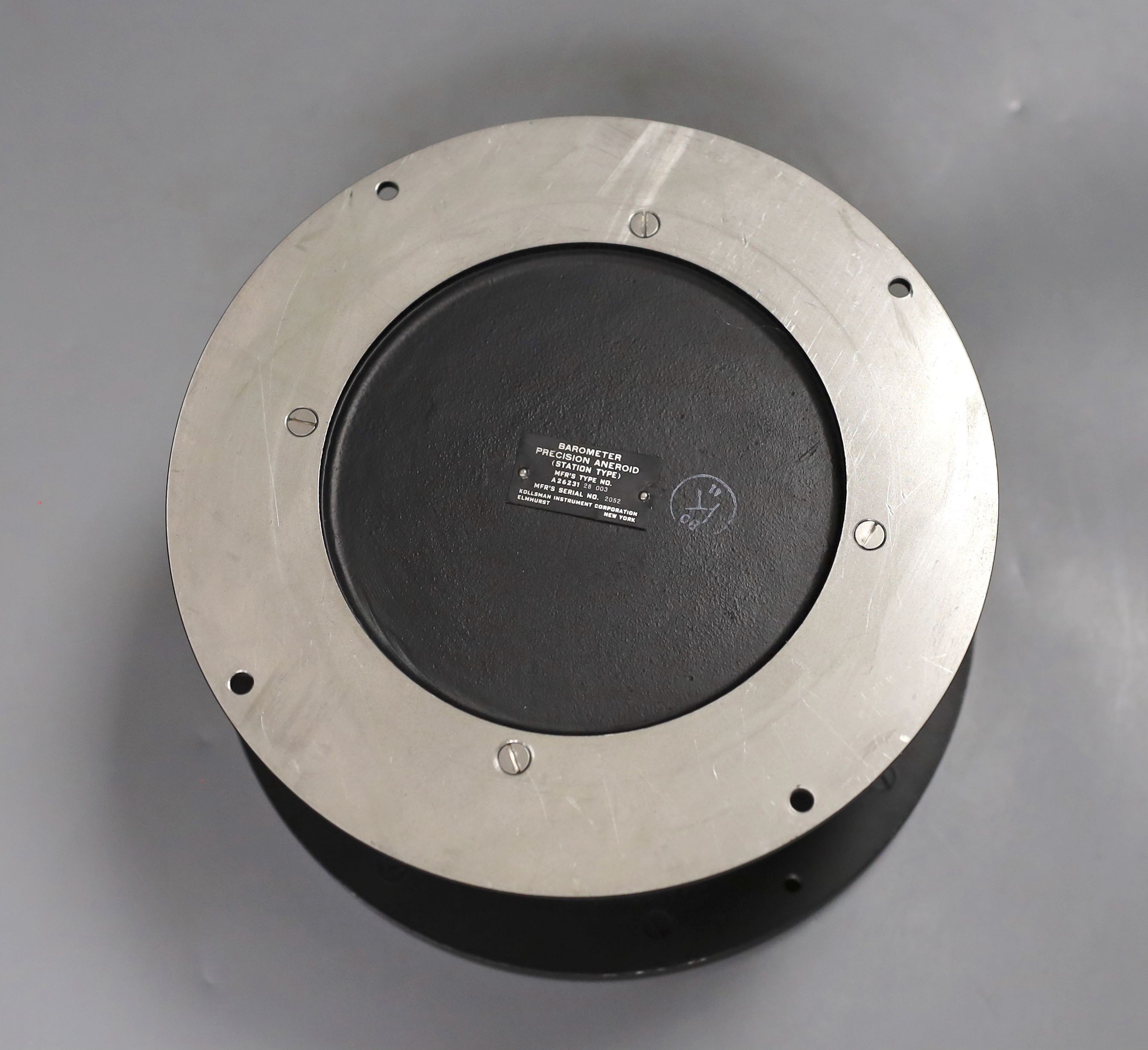 A U.S. Weather Bureau barometer , millibars 990-800, serial number 2052, 21 cms diameter.